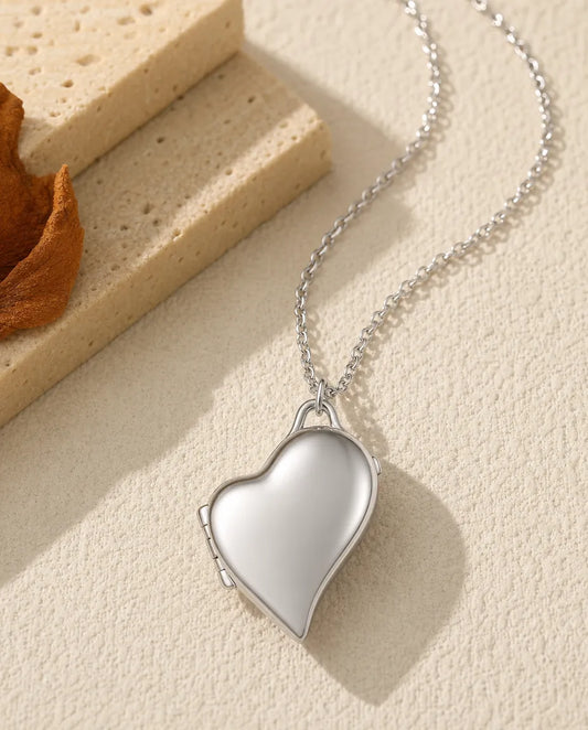 Personalised asymmetric heart photo locket necklace holding two pictures, silver and gold