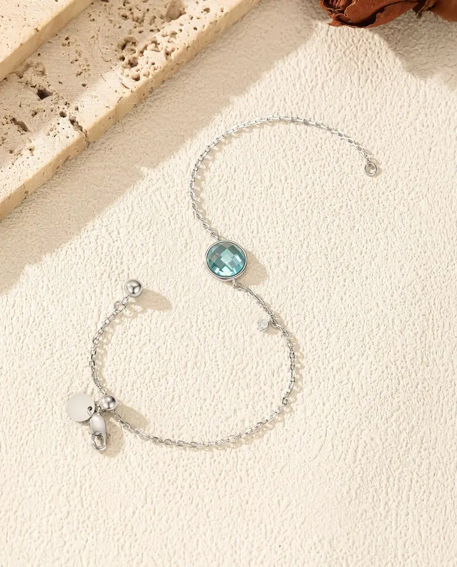 Blue checkerboard cut zirconia bolo slider bracelet in 925 sterling silver