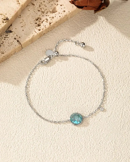 Blue checkerboard cut zirconia bolo slider bracelet in 925 sterling silver
