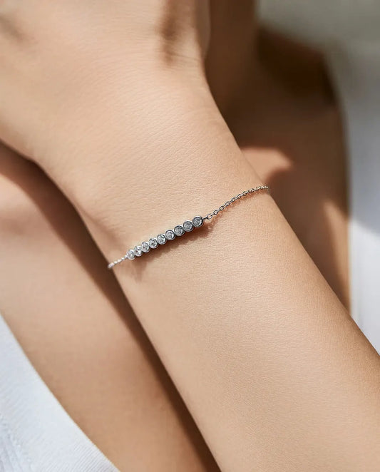 Dainty moissanite station bracelet, 9 round D colour stones, 925 sterling silver