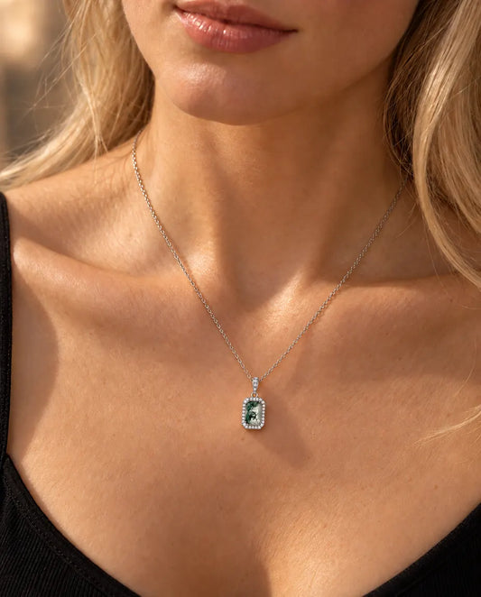 Emerald Cut Moss Agate Halo Necklace in 925 Sterling Silver - worn on a model, close-up at the collarbone