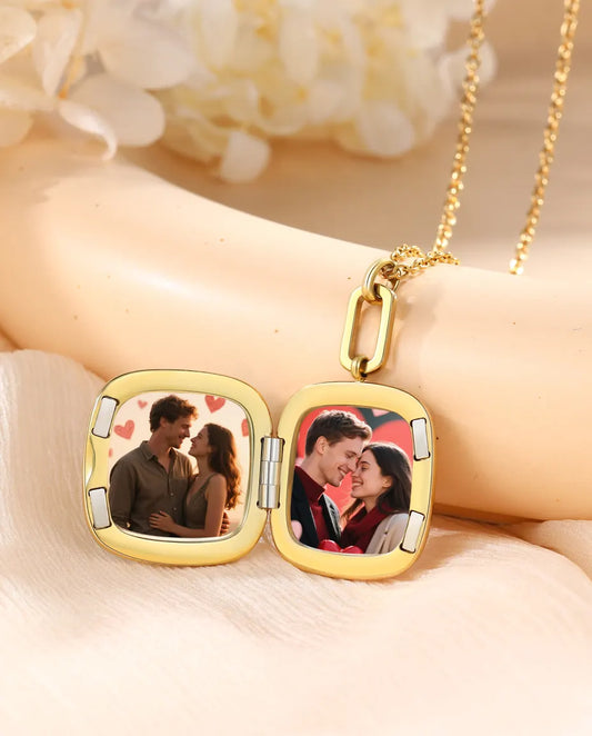 Enamel locket open showing two square photos inside