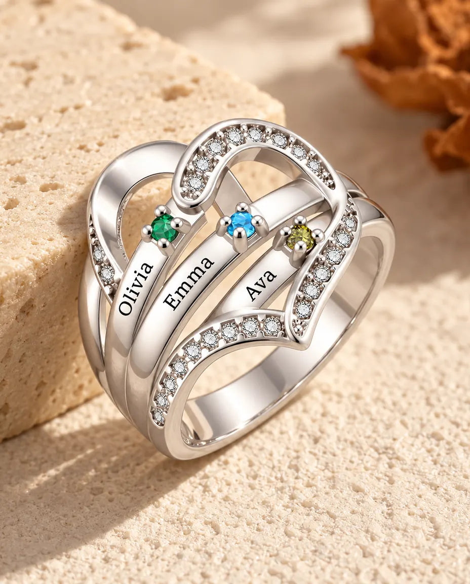 personalised heart birthstone ring with 3 engraved names and 3 prong set birthstones on polished ribbons, rhodium plated