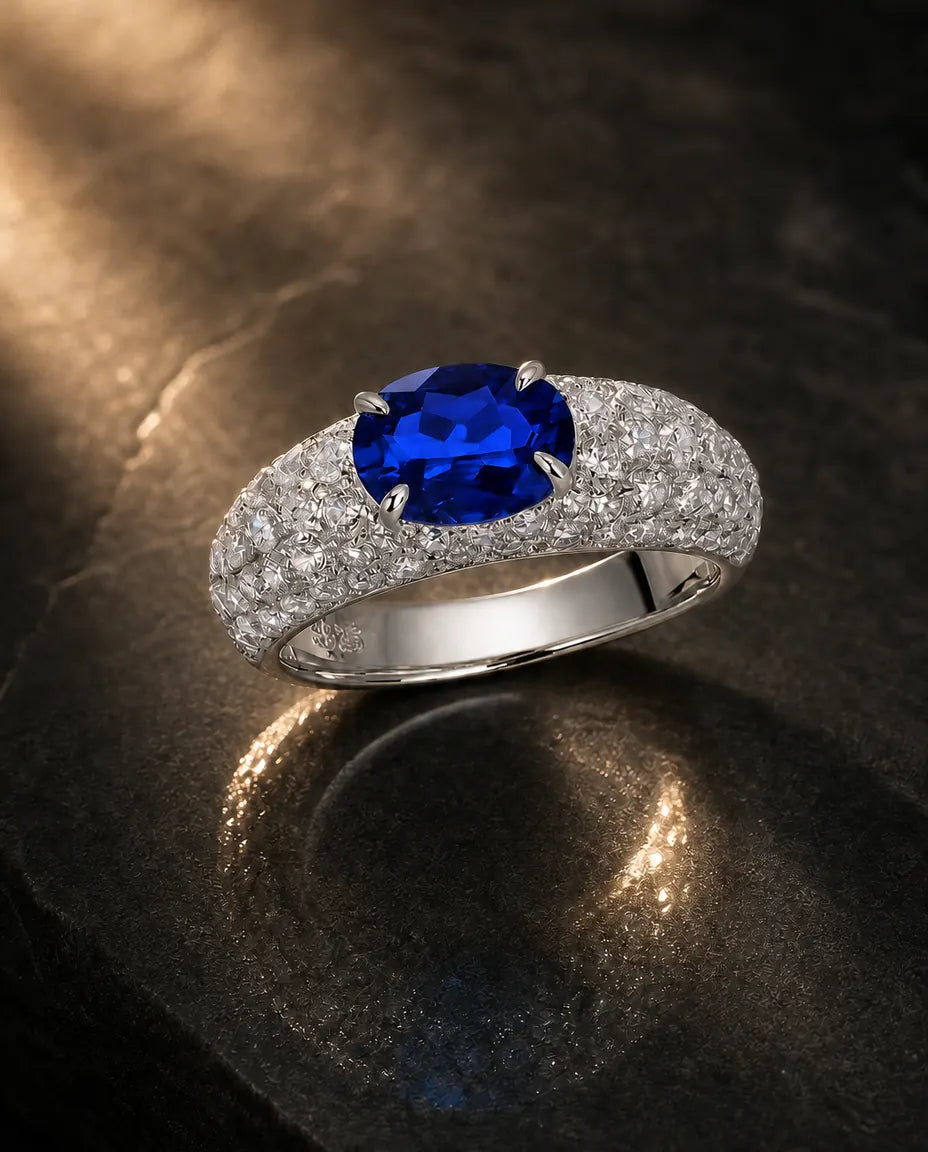 Lab-created blue sapphire oval ring in 925 sterling silver with white pave band
