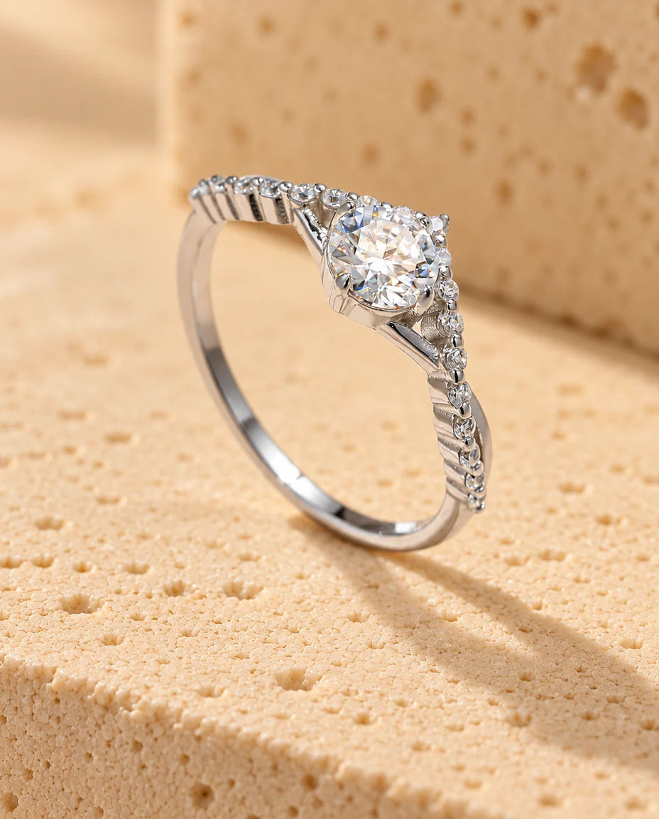 Moissanite Engagement Ring - displayed on a travertine block