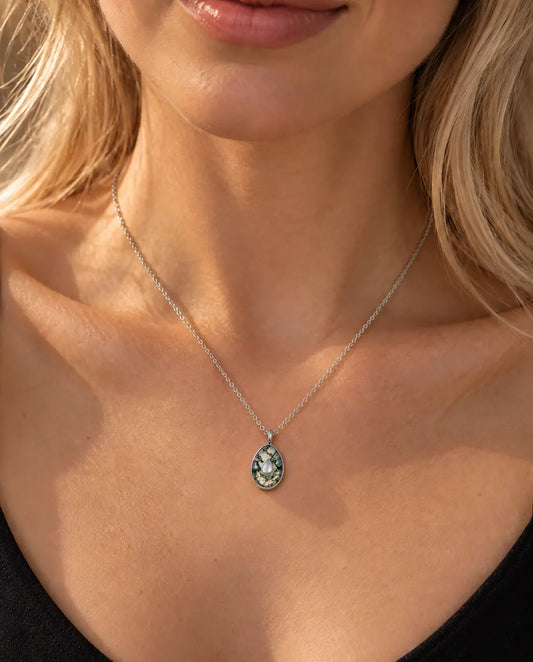 Moss Agate Egg Pendant Necklace in 925 Sterling Silver - worn on a model, close-up at the collarbone