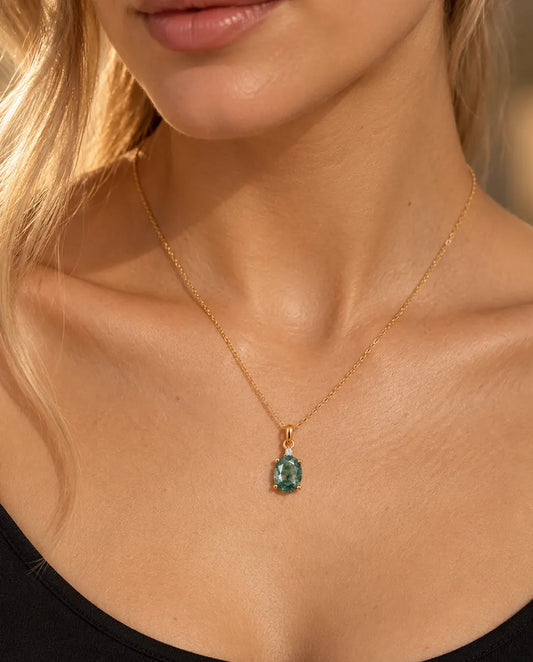 Oval Moss Agate Solitaire Necklace in Gold Plated 925 Sterling Silver - worn on a model, close-up at the collarbone