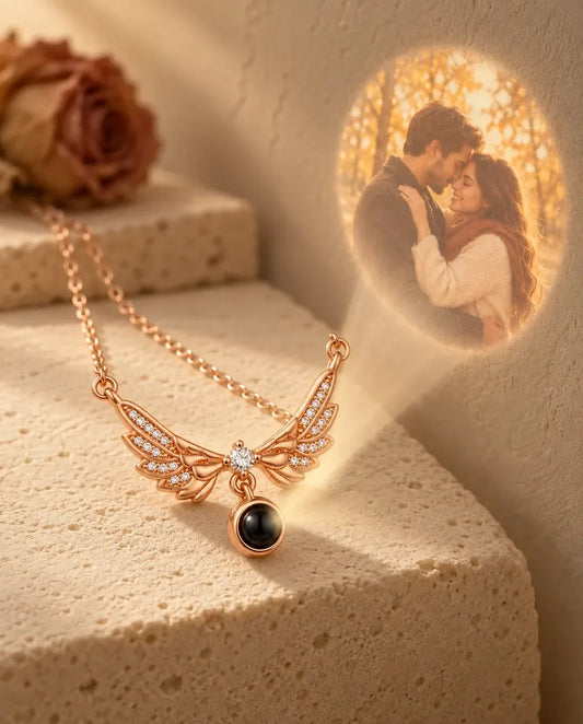 Personalised Angel Wing Photo Projection Necklace in Rose Gold - projecting the hidden photo onto a wall