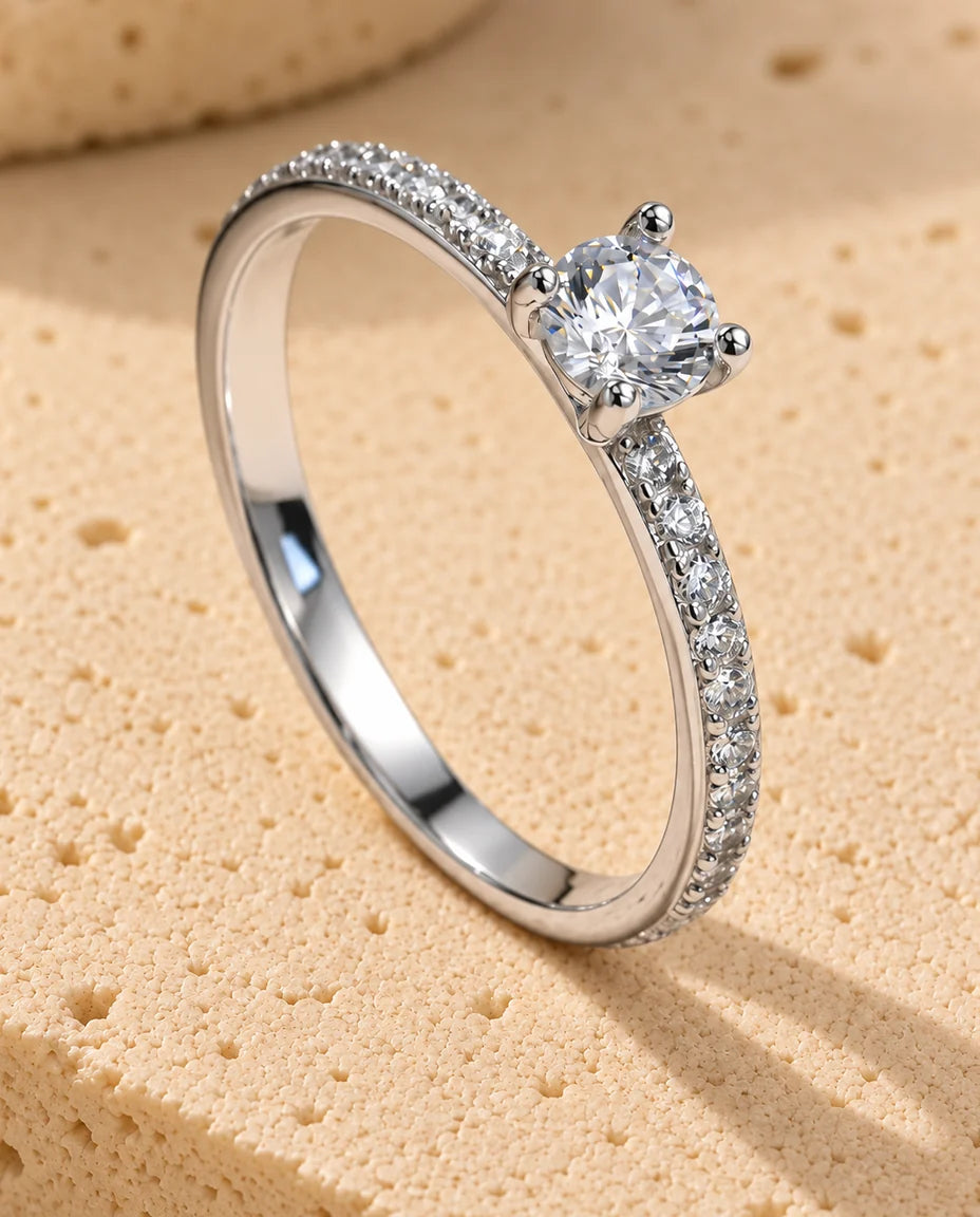 Moissanite Engagement Ring - displayed on a travertine block