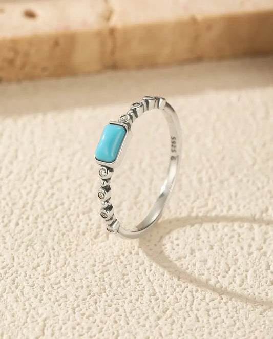 Turquoise cabochon ring on beaded bezel band in 925 sterling silver
