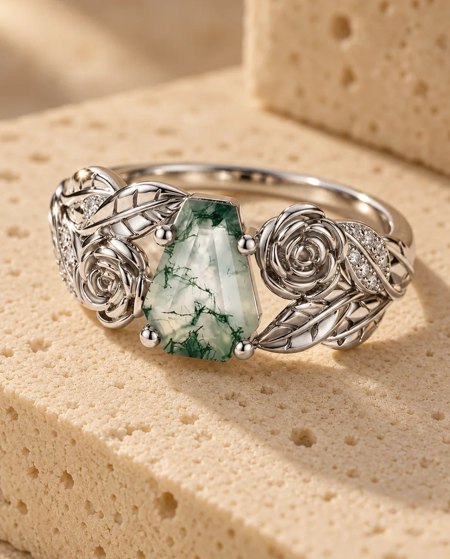 Moss Agate Ring - displayed on a travertine block