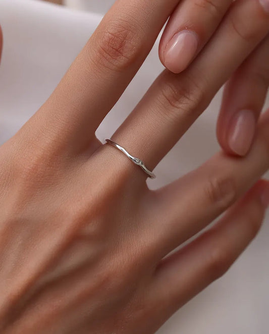 Wavy Stacking Ring in 925 Sterling Silver - worn on a model’s finger, close-up