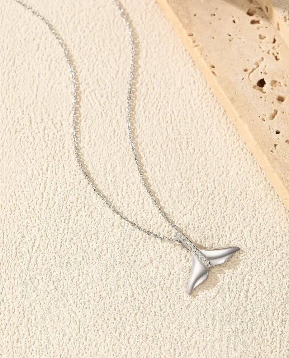 Whale tail pendant necklace in 925 sterling silver with a pave set bail