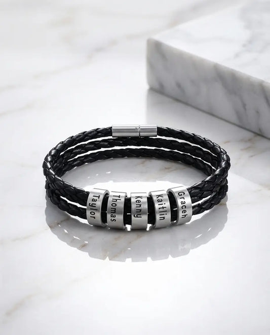 Personalised men's braided leather bracelet with engraved silver name beads, an unusual 18th birthday gift for him