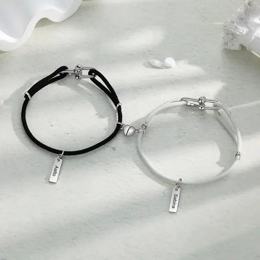 Matching his and hers couples bracelets in sterling silver with engraved name bars