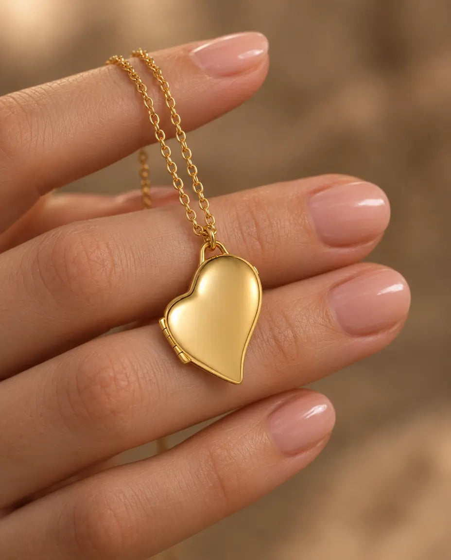 Personalised Asymmetric Heart Photo Locket Necklace That Holds 2 Pictures held in hand