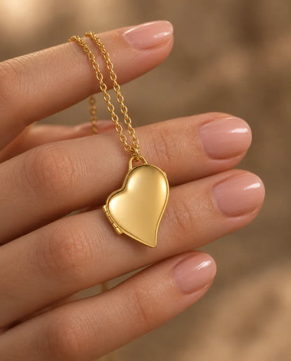 Personalised Asymmetric Heart Photo Locket Necklace That Holds 2 Pictures held in hand