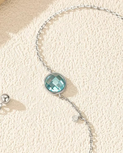 Blue checkerboard cut zirconia bolo slider bracelet in 925 sterling silver