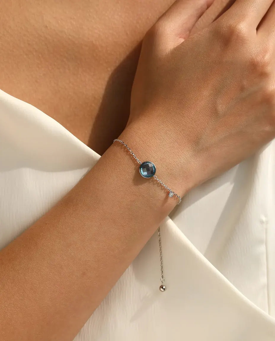 Blue checkerboard cut zirconia bolo slider bracelet in 925 sterling silver