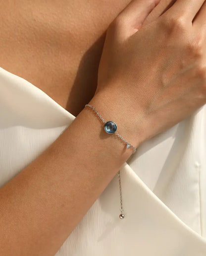 Blue checkerboard cut zirconia bolo slider bracelet in 925 sterling silver