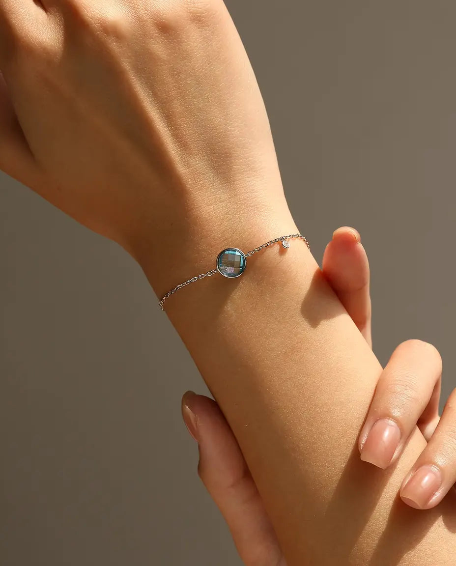 Blue checkerboard cut zirconia bolo slider bracelet in 925 sterling silver