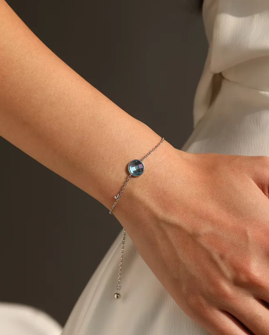 Blue checkerboard cut zirconia bolo slider bracelet in 925 sterling silver