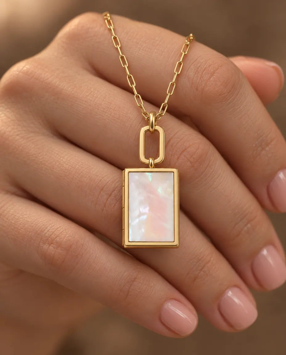 Personalised Book Photo Locket Necklace That Holds 2 Pictures held in hand