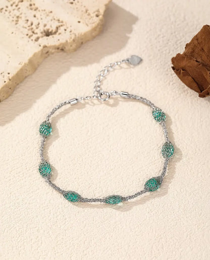 Caged Zircon Bracelet in 925 Sterling Silver - green zircon version, closer view of the wire mesh