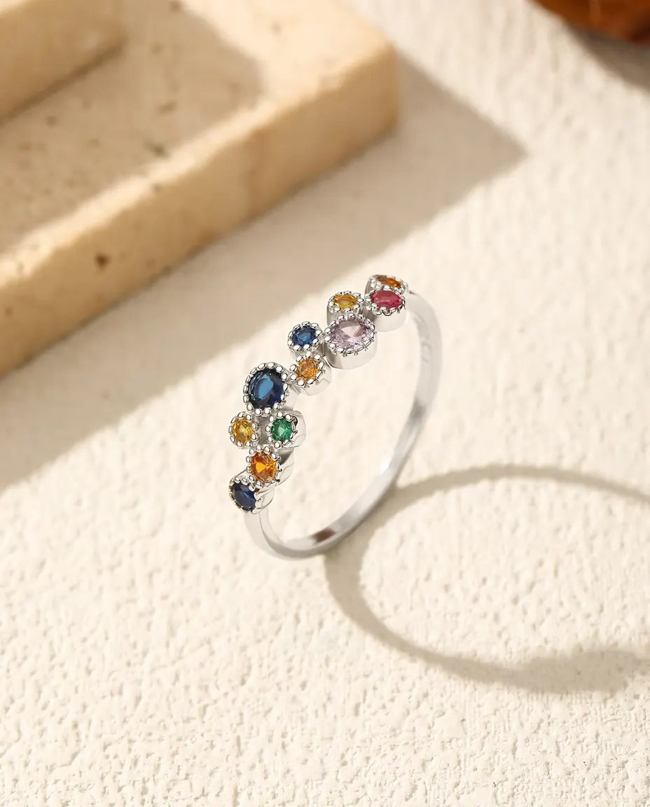 Colourful zirconia cluster ring with milgrain halos in 925 silver