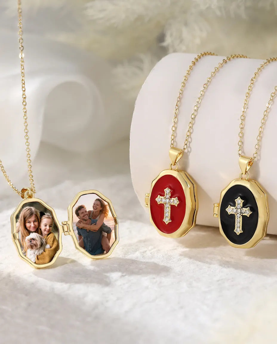 Cross photo locket necklace collection showing open locket and three enamel colours