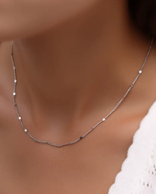 Station Chain Necklace in 925 Sterling Silver - worn on a model, close-up at the collarbone