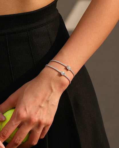 Tennis bracelet with a 1ct D colour emerald cut moissanite centre stone and cubic zirconia side stones, 925 sterling silver