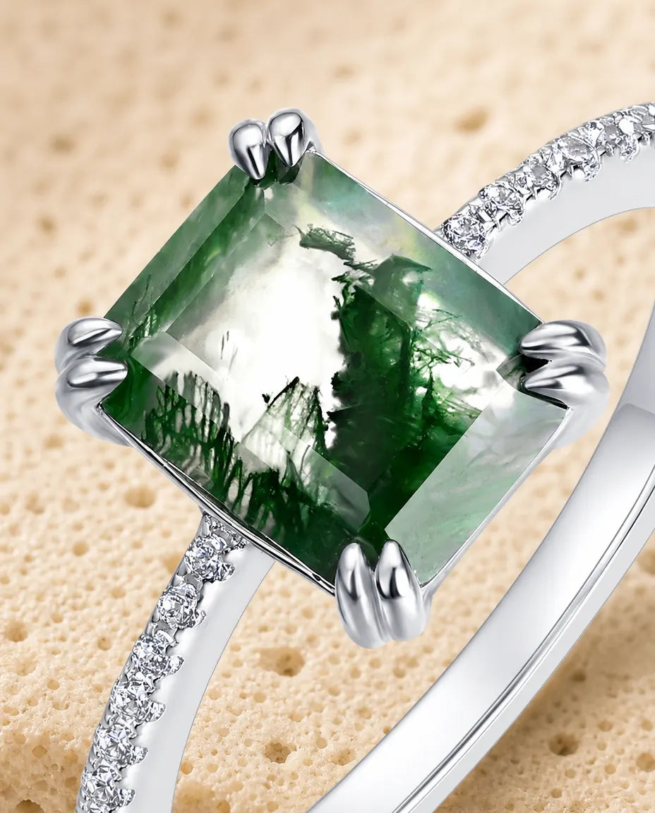 Emerald-cut moss agate pave solitaire ring in sterling silver with double-claw prongs and pave band