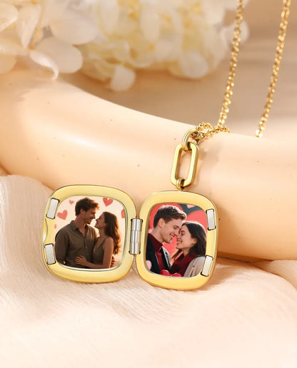 Enamel locket open showing two square photos inside