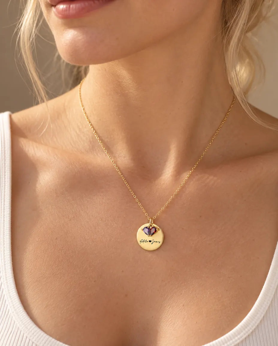 Blonde woman wearing the personalised gold disc birthstone necklace