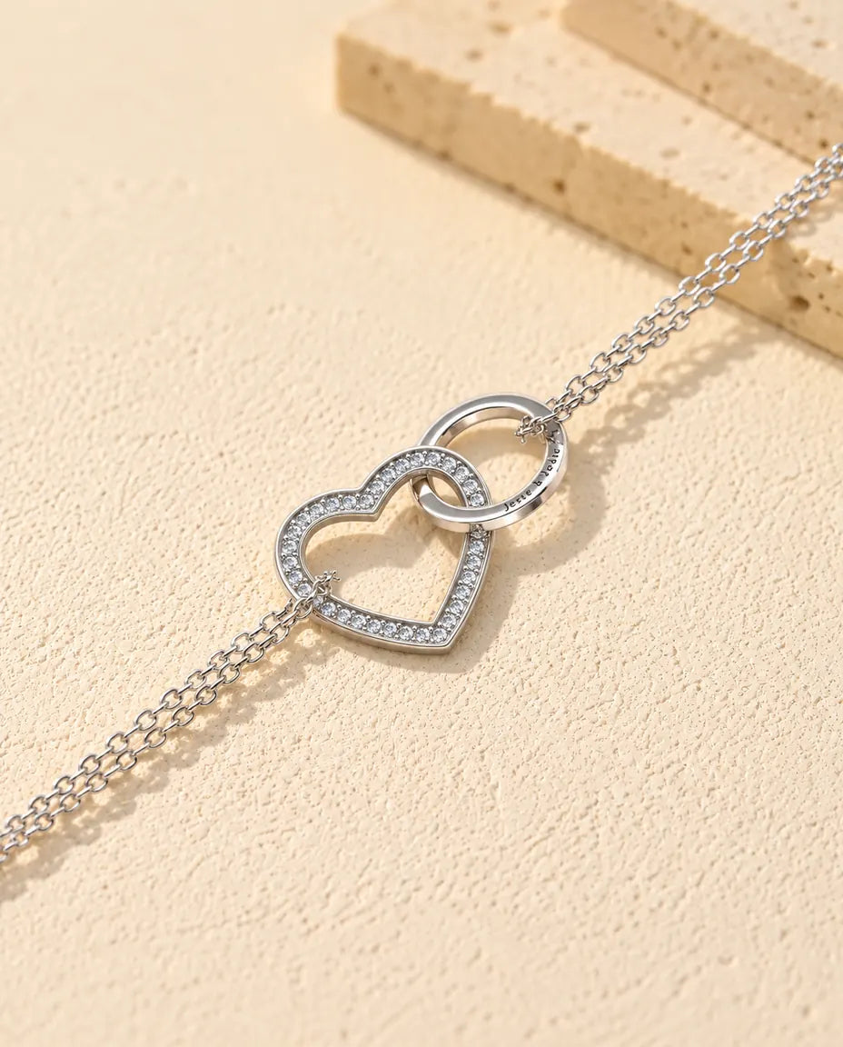 Personalised Interlocking Heart Bracelet - close-up of the projection charm