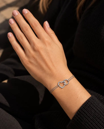 Personalised Interlocking Heart Bracelet - worn on the wrist, close-up