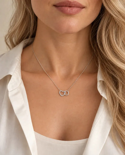 Interlocking Heart Necklace - worn on a model