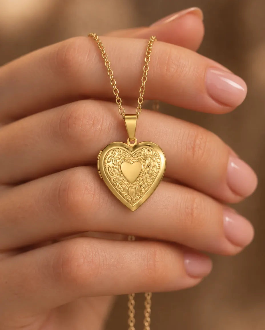 Personalised Floral Heart Locket Necklace That Holds 2 Photos with Custom Back Engraving held in hand