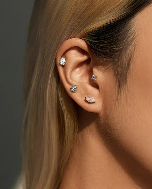 Four-Stone Moissanite Clover Stud Earrings in 925 Sterling Silver - worn in the ear, close-up