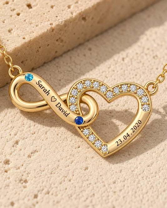 Close-up of the infinity threaded through the pave heart with two birthstones