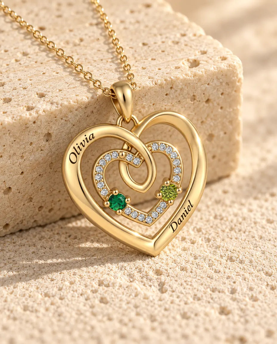 Close-up of the three nested hearts with a pave middle heart and two birthstones