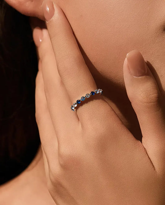 Blue Cubic Zirconia Eternity Ring in 925 Sterling Silver - worn on a model