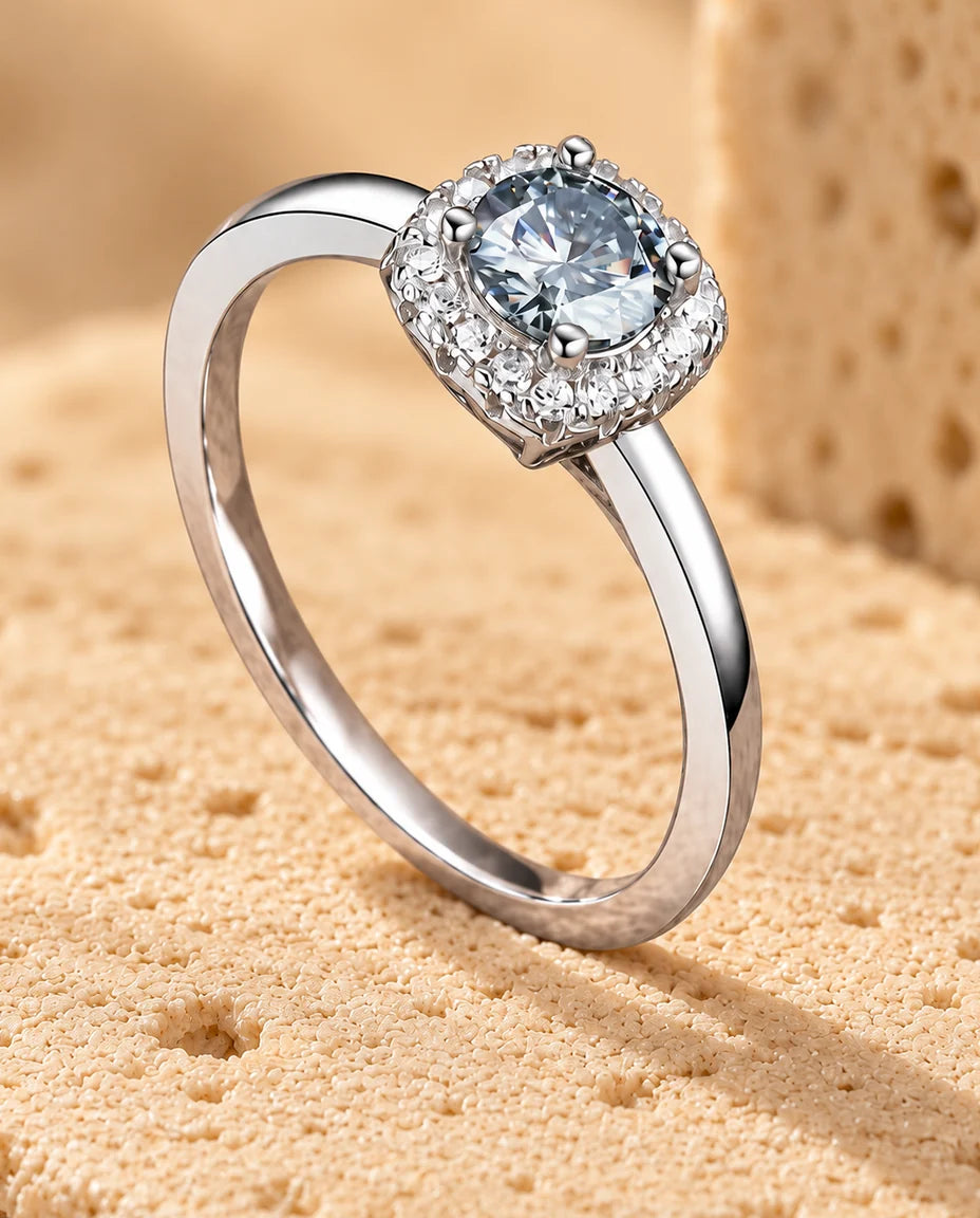 Moissanite Engagement Ring - displayed on a travertine block