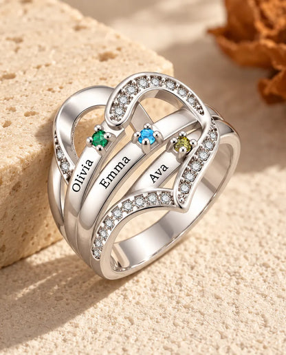 personalised heart birthstone ring with 3 engraved names and 3 prong set birthstones on polished ribbons, rhodium plated
