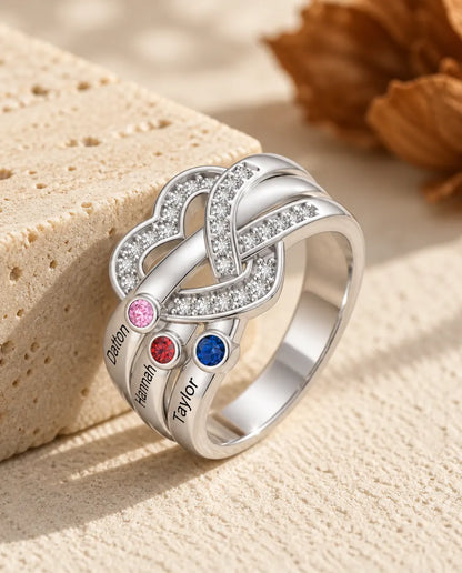 heart knot birthstone ring with 3 engraved names and 3 bezel set birthstones on the left shoulder