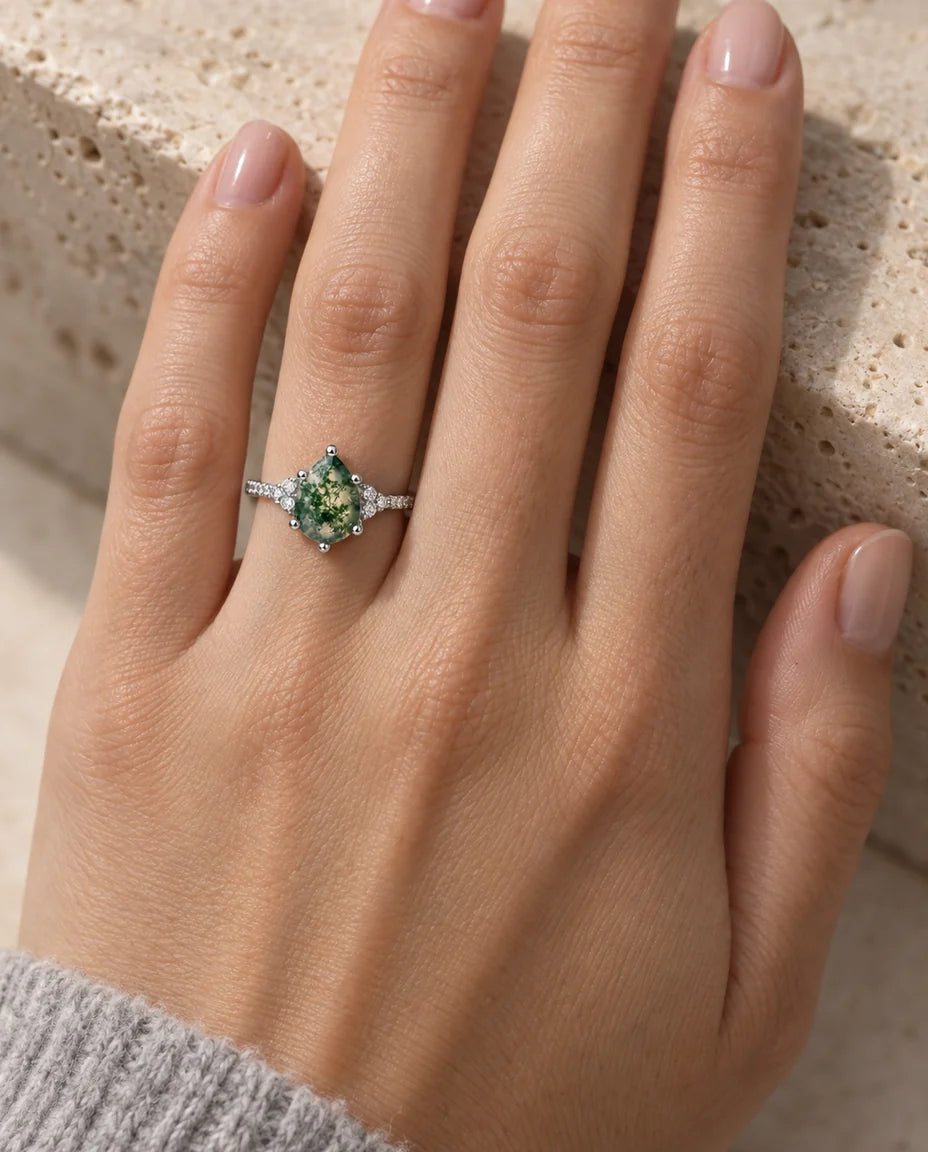 Pear Shaped Moss Agate Ring - worn on the hand, silver finish