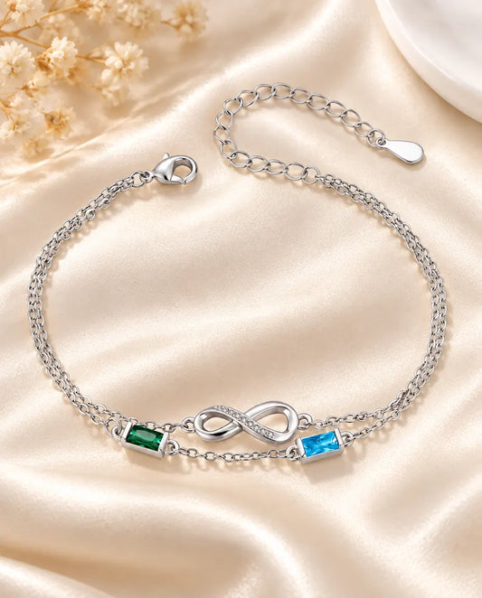 Personalised infinity birthstone bracelet with two baguette birthstones on a double silver chain