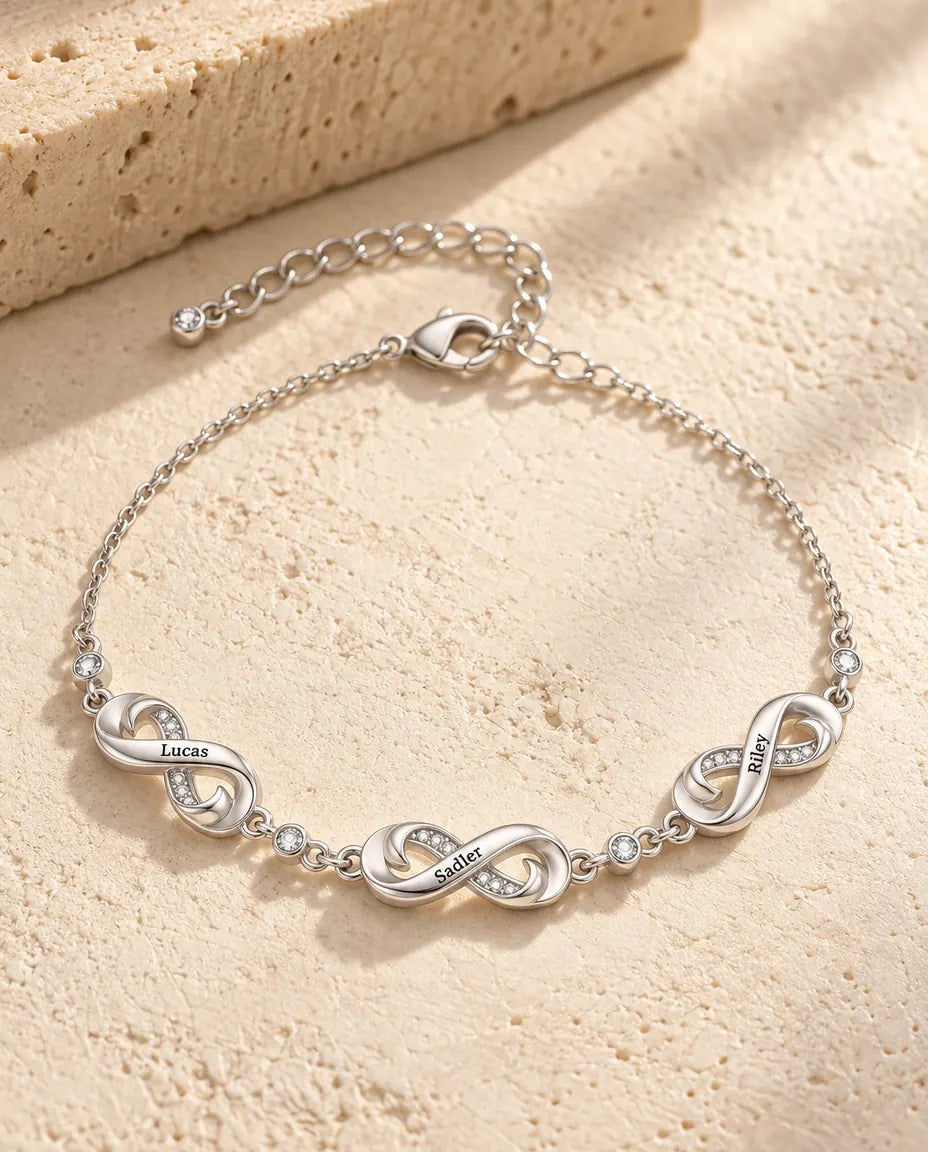 Personalised infinity name bracelet with three engraved infinity charms and cubic zirconia