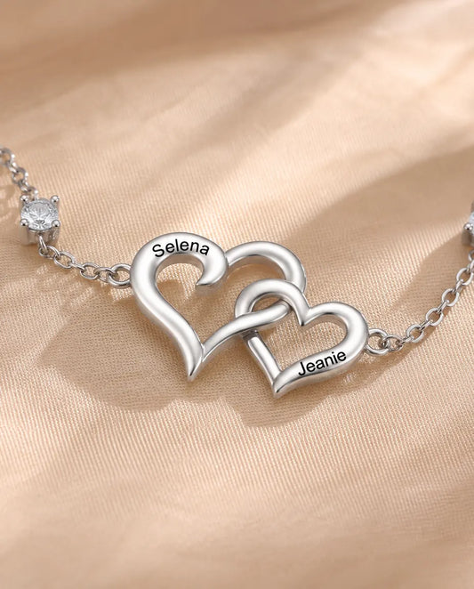 Close-up of the two interlocking hearts with a name engraved on each